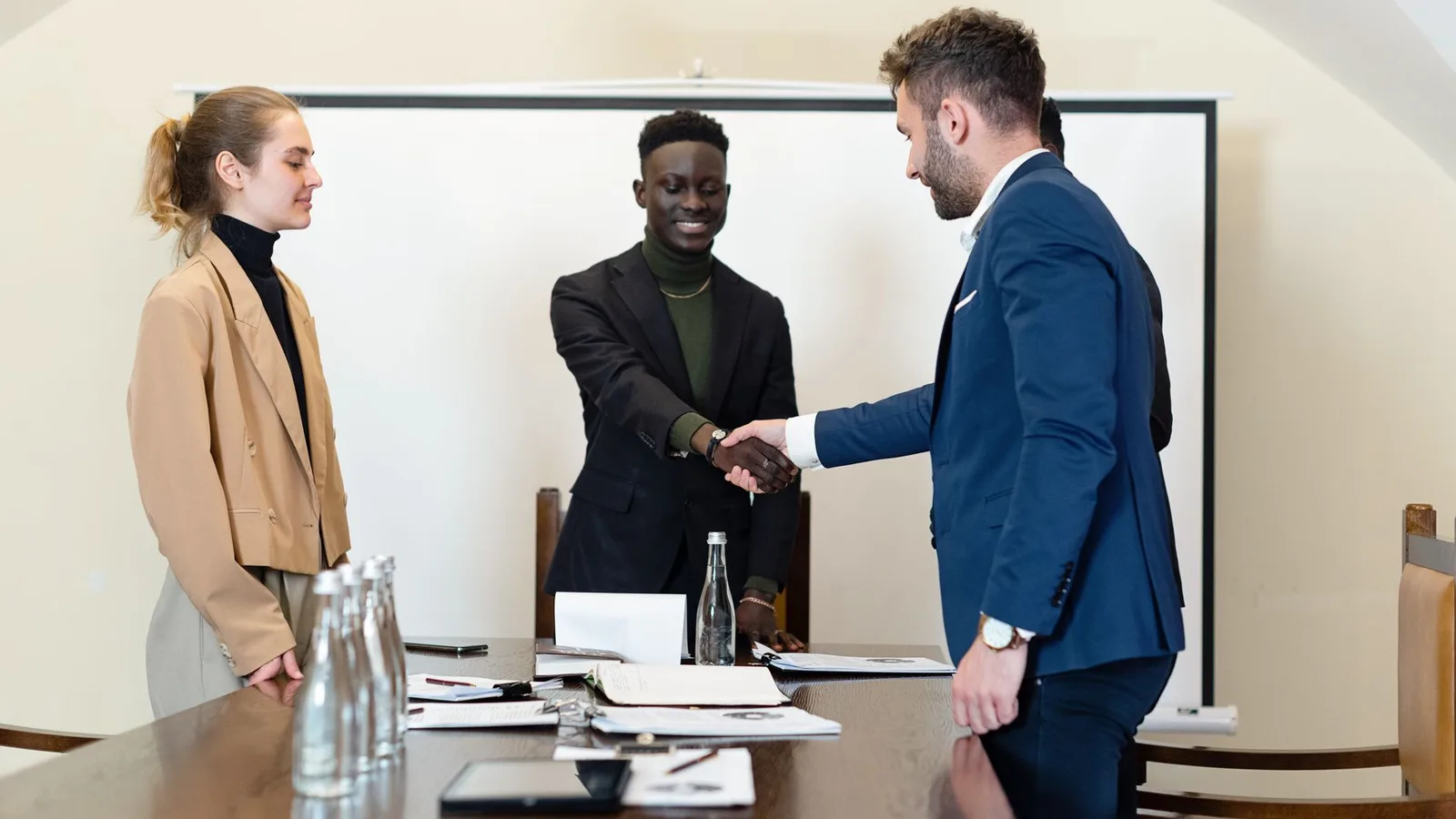 Business professionals in a corporate meeting reviewing commercial finance structuring agreements