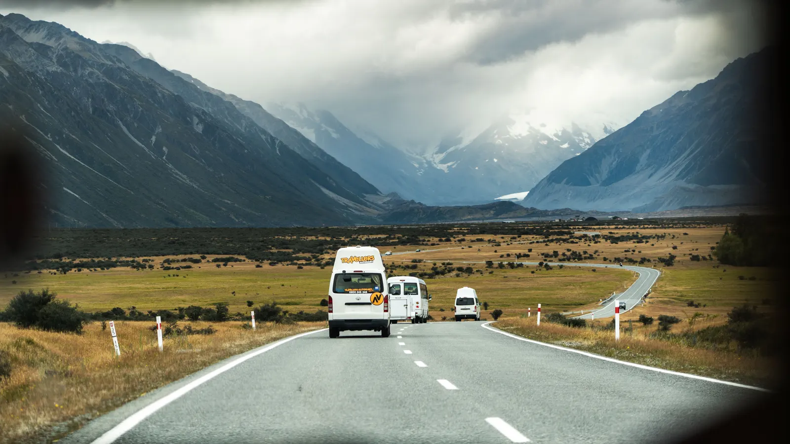 Van and truck travelling along an open highway