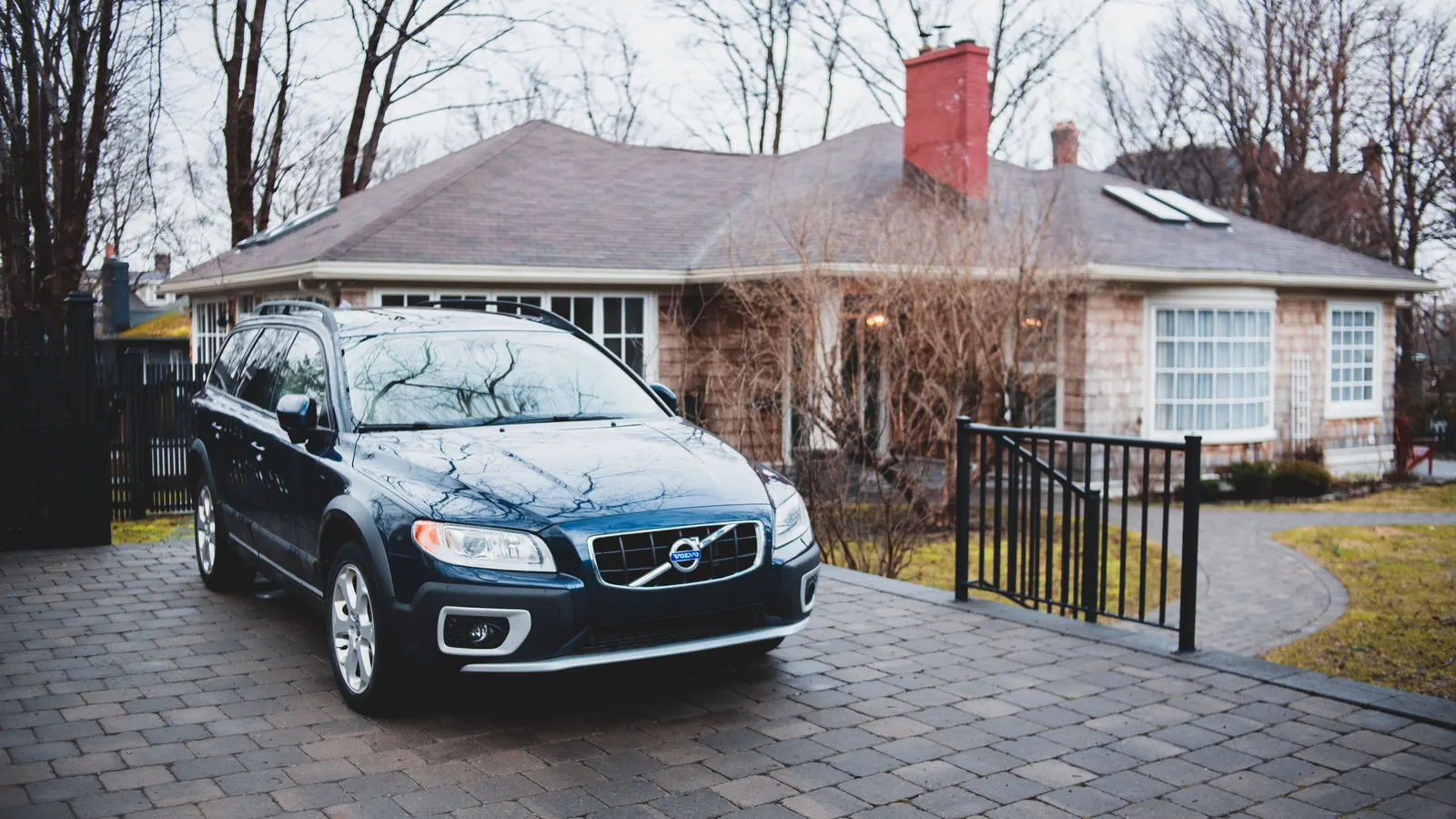 Car parked in a suburban driveway, representing personal-use borrowing that falls outside commercial vehicle finance