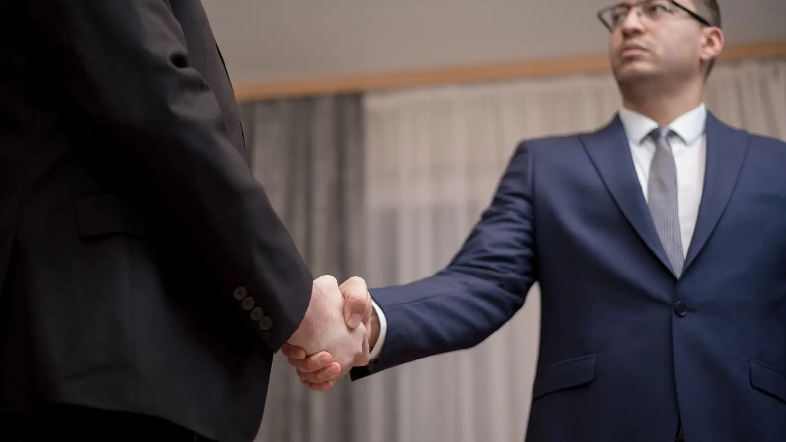 Two business people shaking hands after a meeting