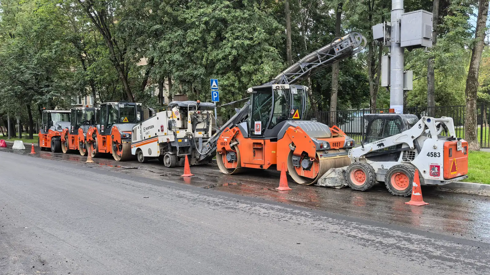 Road construction machinery lined up on an urban street, illustrating the range of plant construction equipment financing covers