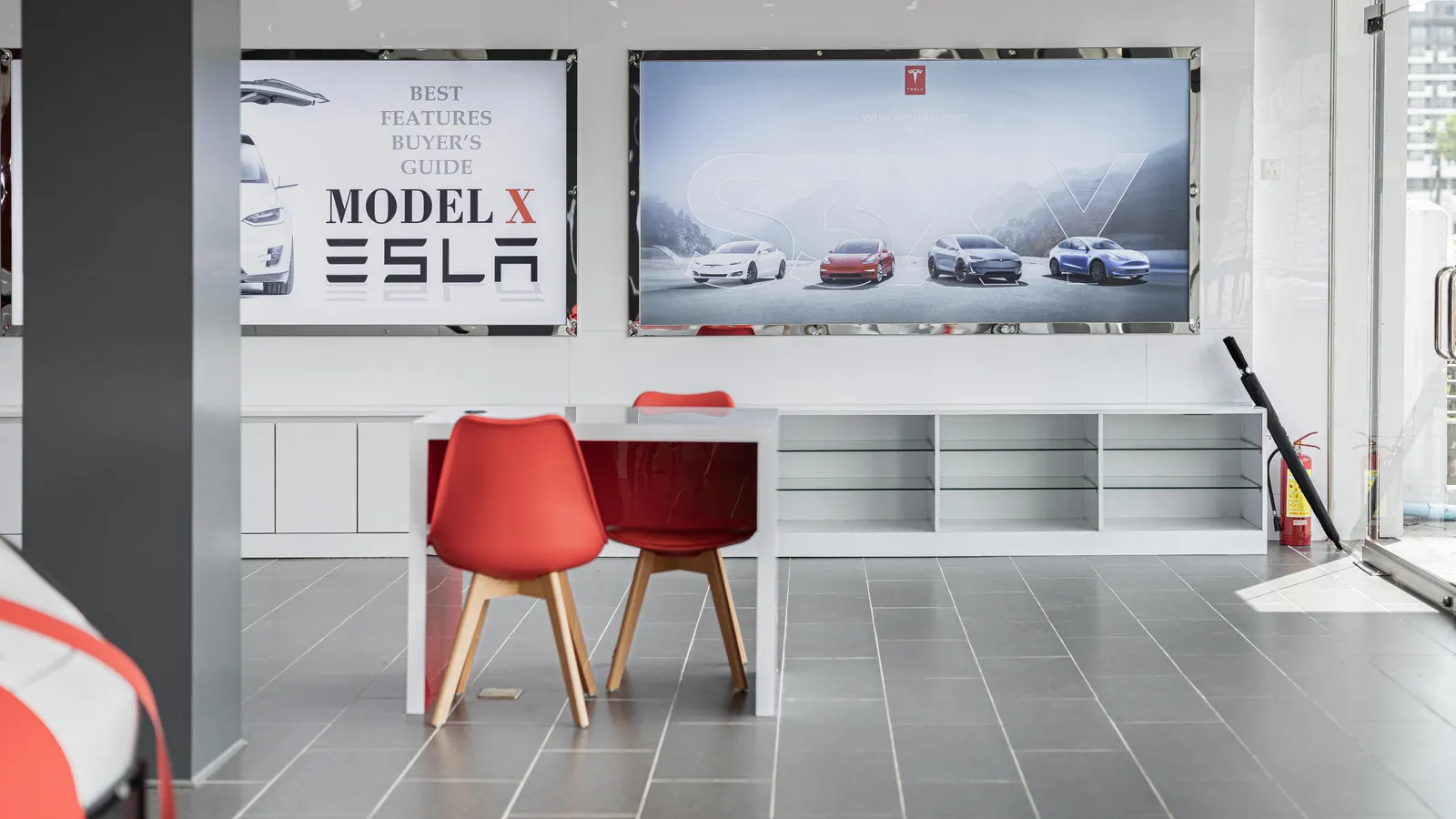 Electric vehicle on display inside a car dealership showroom, representing a new EV purchase