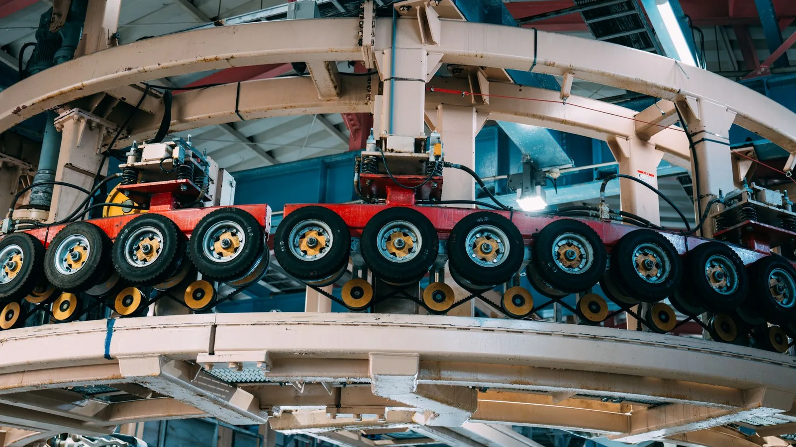 Close-up view of a complex industrial conveyor system inside a manufacturing facility, an example of equipment finance