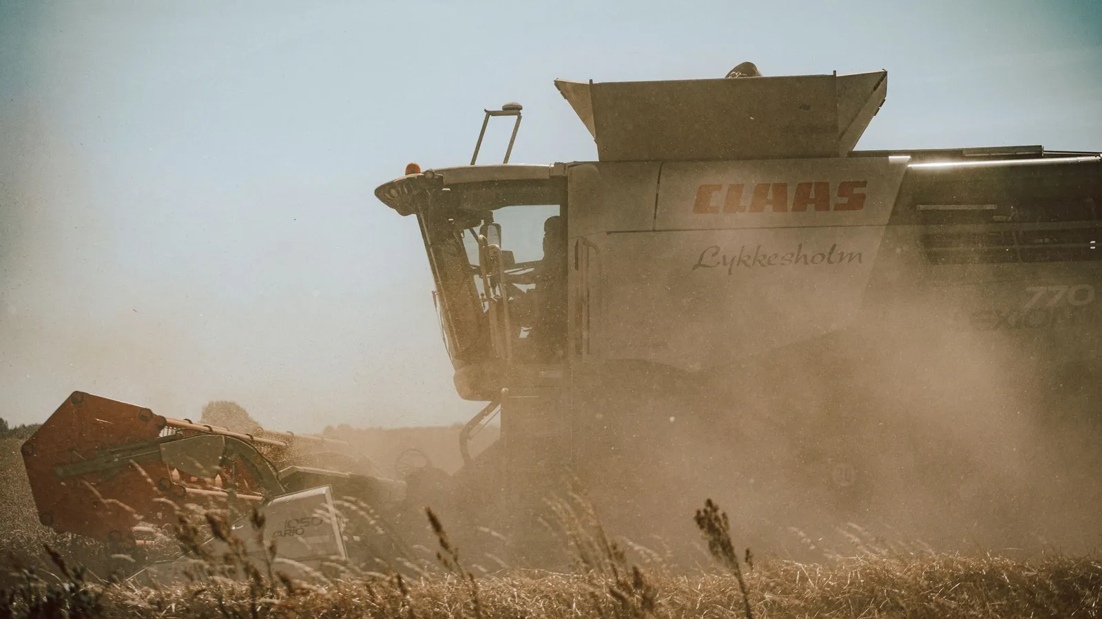 Combine harvester working a crop field, illustrating the range of machinery farm equipment financing covers
