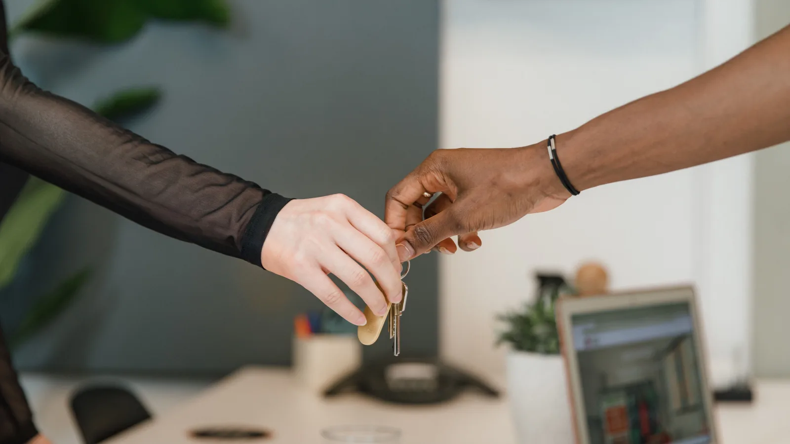 Hands exchanging car keys, the moment motor vehicle finance in NZ is built to fund