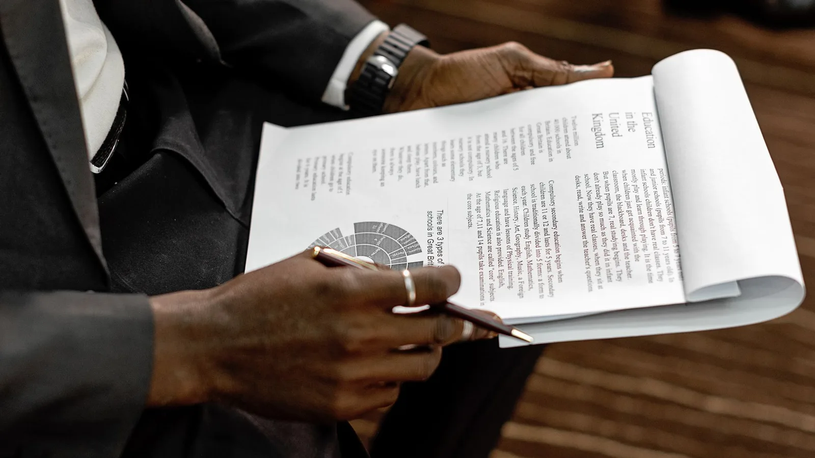 Business borrower reviewing loan criteria and financial documentation with an advisor
