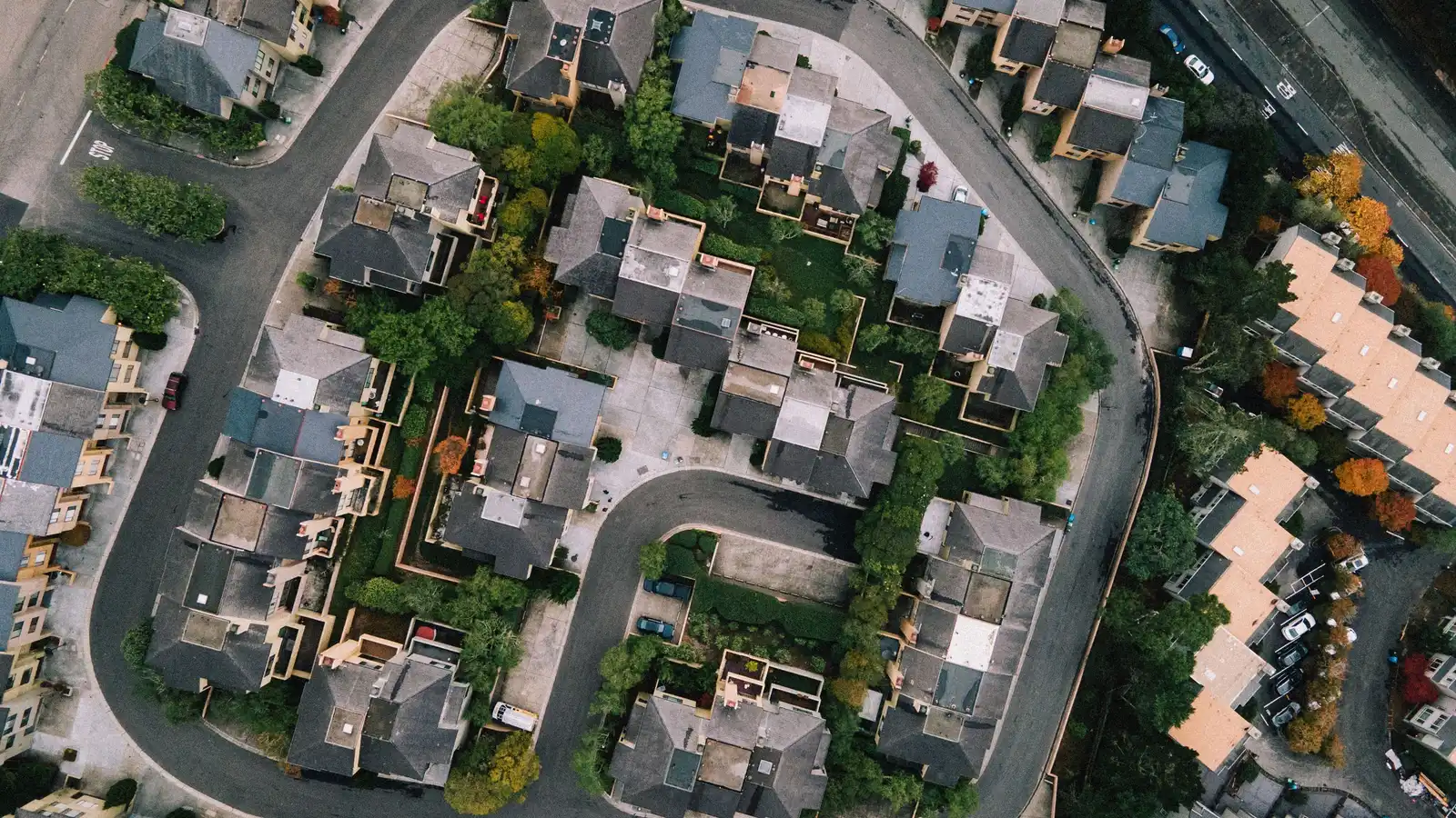 Aerial view of a residential street, representing personal-use borrowing that falls outside commercial truck finance