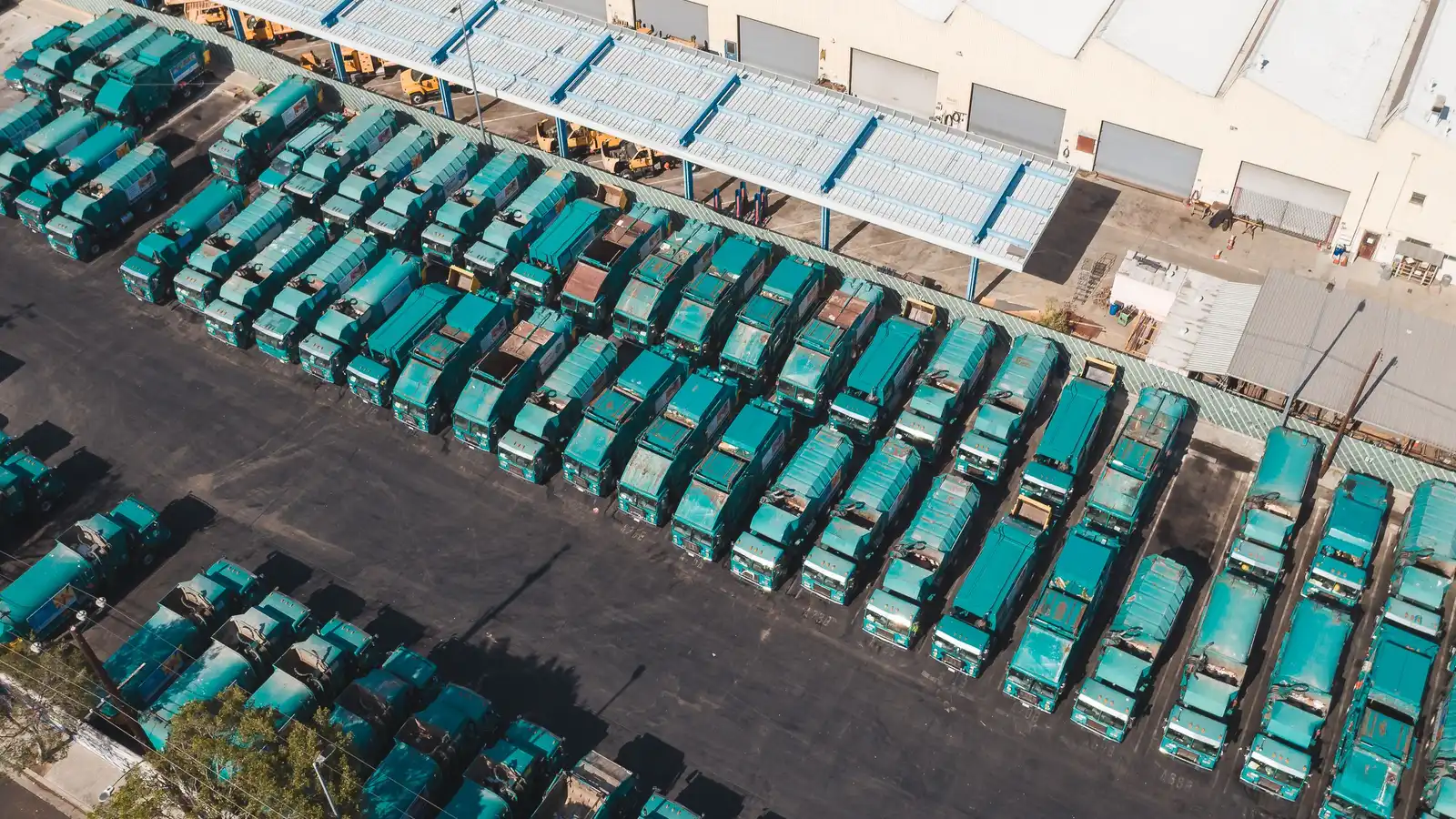 Fleet of trucks parked at a depot, the type of vehicles funded through truck finance in NZ