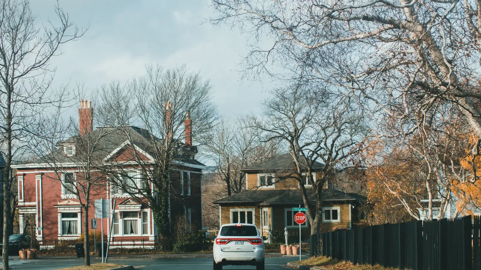 Aerial view of a quiet suburban street, representing personal-use borrowing that falls outside commercial ute finance